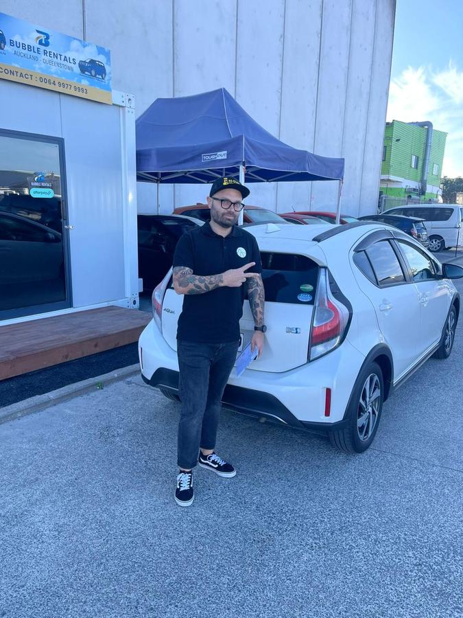 Happy Bubble Rentals customer with their rental car