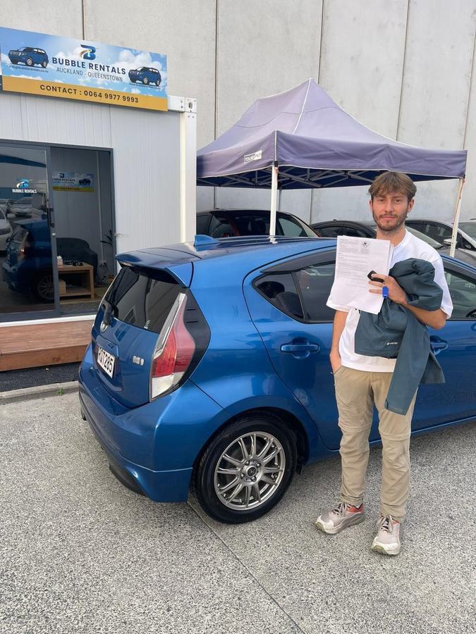 Happy Bubble Rentals customer with their rental car